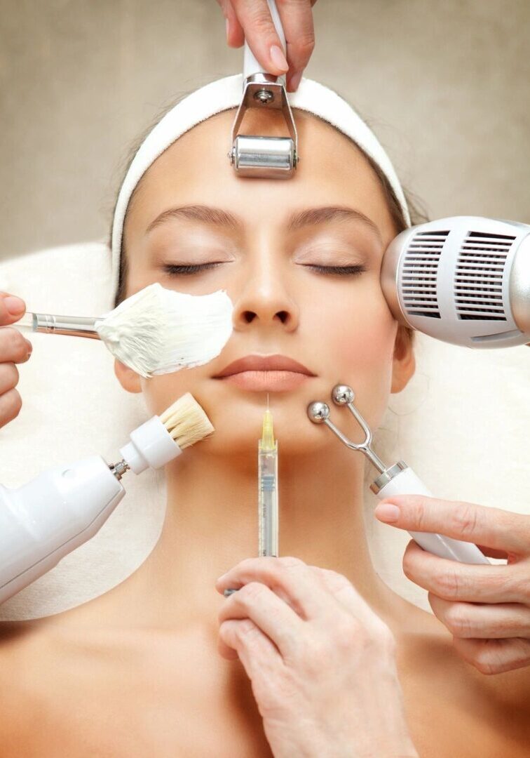 A woman getting her face waxed by several hands.